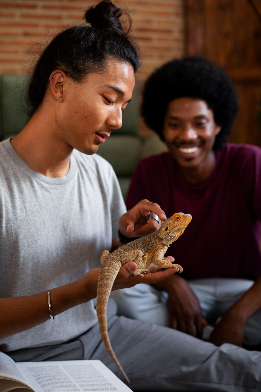 person with lizard at home